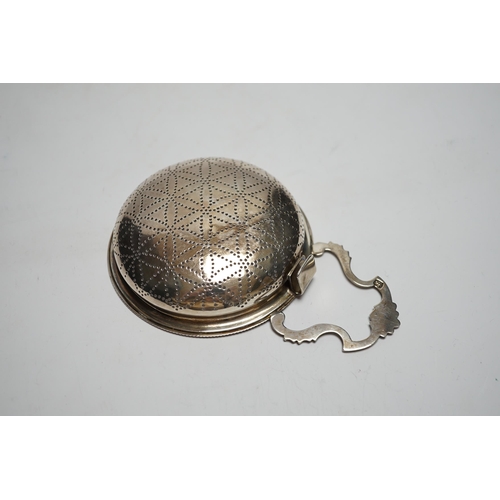 830 - A late George II silver lemon strainer, maker WS?, London, 1759?, 14.7cm.