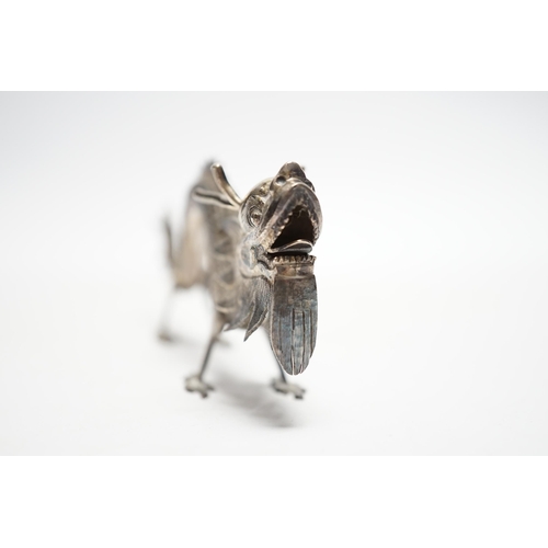 844 - A Chinese white metal toothpick holder, modelled as a free standing model of a dragon, 12.4cm.... 