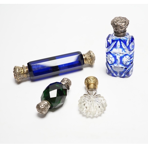 847 - Four assorted Victorian white or gilt metal mounted cut glass scent bottles, including double ended ... 