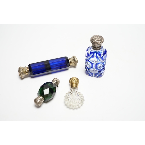 847 - Four assorted Victorian white or gilt metal mounted cut glass scent bottles, including double ended ... 