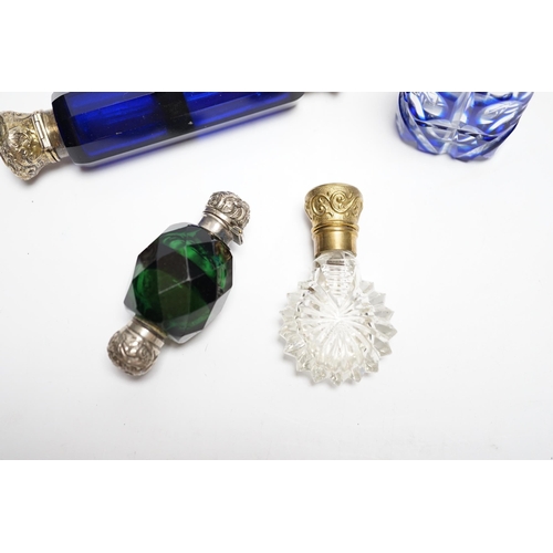 847 - Four assorted Victorian white or gilt metal mounted cut glass scent bottles, including double ended ... 