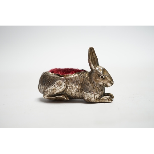 853 - An Edwardian novelty silver mounted pin cushion, modelled as a recumbent rabbit, Henry Matthews, Bir... 