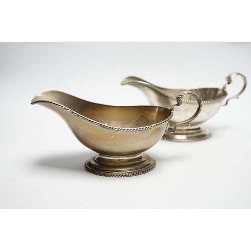 861 - A pair of George V silver oval pedestal sauceboats, London, 1917, 19cm length, 10.6oz.