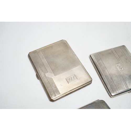 876 - Three silver cigarette cases, including two Art Deco, largest 11.4cm.