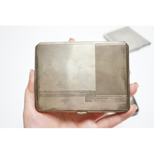 876 - Three silver cigarette cases, including two Art Deco, largest 11.4cm.