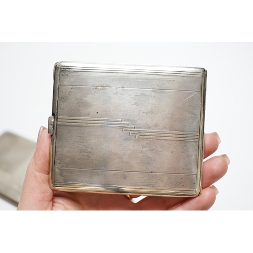 876 - Three silver cigarette cases, including two Art Deco, largest 11.4cm.