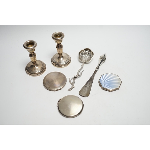 878 - Three silver compacts including one enamelled, a pair of silver mounted dwarf candlesticks, 10.2cm a... 