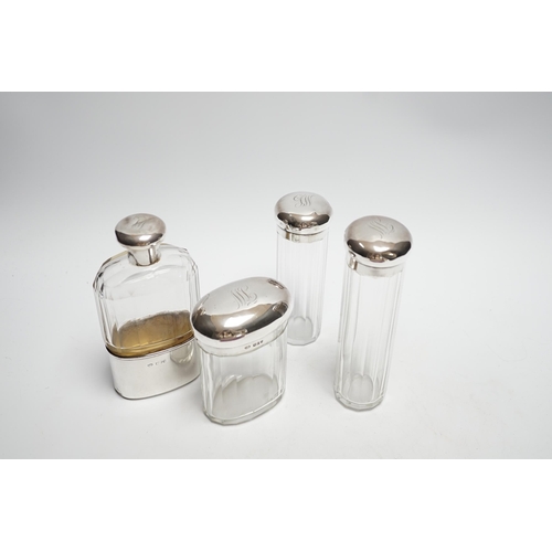 880 - A George V silver mounted glass hip flask, London, 1912, 15.2cm, together with three matching silver... 