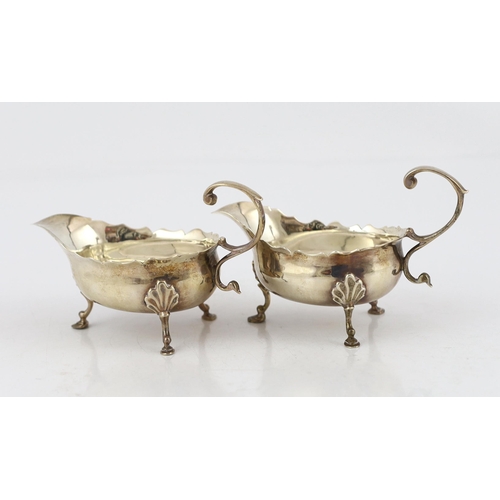 881 - A pair of late George II silver small sauce boats, by Robert Albin Cox, with cut rims and flying scr... 