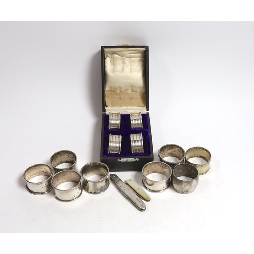 883 - A cased set of four George V silver napkin rings, Rolason Brothers, Birmingham, 1920, together with ... 