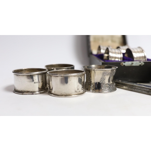 883 - A cased set of four George V silver napkin rings, Rolason Brothers, Birmingham, 1920, together with ... 