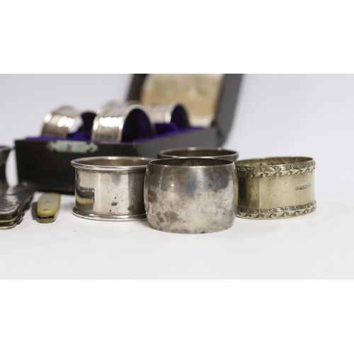 883 - A cased set of four George V silver napkin rings, Rolason Brothers, Birmingham, 1920, together with ... 