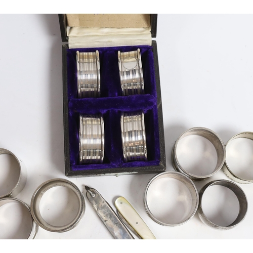 883 - A cased set of four George V silver napkin rings, Rolason Brothers, Birmingham, 1920, together with ... 