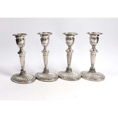 884 - A set of four Elizabeth II silver candlesticks, with fluted stems and bases, C.J. Vander Ltd, London... 