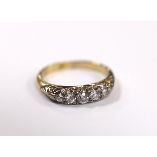 902 - An 18ct and graduated five stone diamond set half hoop ring, size M, gross weight 3.4 grams.