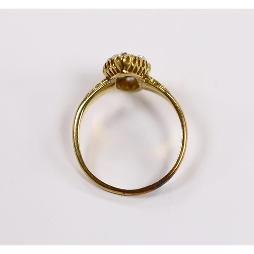 903 - An early 20th century yellow metal and old round cut diamond cluster set marquise shaped ring, size ... 