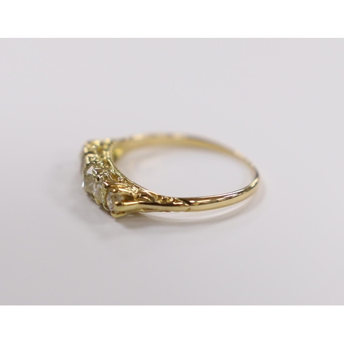 907 - An early 20th century yellow metal and graduated five stone old round diamond set half hoop ring, si... 