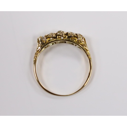 907 - An early 20th century yellow metal and graduated five stone old round diamond set half hoop ring, si... 