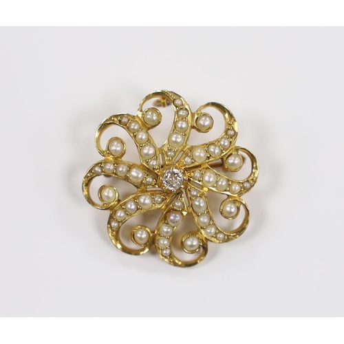 908 - An Edwardian 15ct, seed pearl cluster and single stone diamond set circular brooch, 23mm, gross weig... 