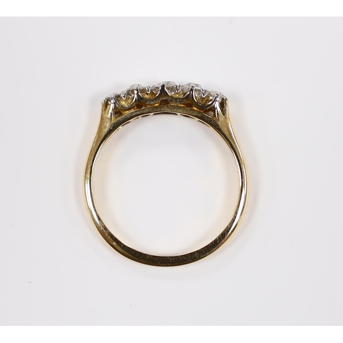 922 - A 1920's 18ct, plat and graduated five stone diamond set half hoop ring, size K/L, gross weight 2.6 ... 