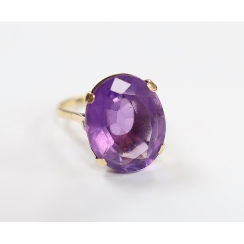 931 - A 9ct and single stone oval cut amethyst set dress ring, size R/S, gross weight 7.5 grams.