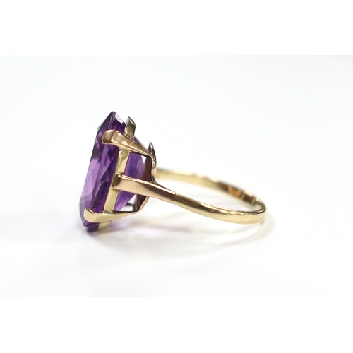 931 - A 9ct and single stone oval cut amethyst set dress ring, size R/S, gross weight 7.5 grams.