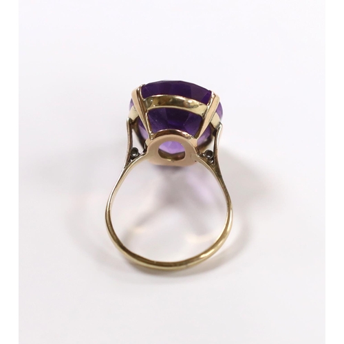 931 - A 9ct and single stone oval cut amethyst set dress ring, size R/S, gross weight 7.5 grams.