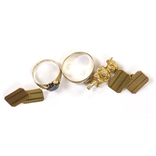 933 - A pair of engine turned 9ct gold cufflinks, a 9ct 'Lincoln Imp' brooch and two 9ct rings including h... 