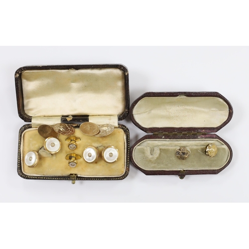 934 - A pair of 9ct gold oval cufflinks, each engraved with a yacht, 5.8 grams, together with two yellow m... 