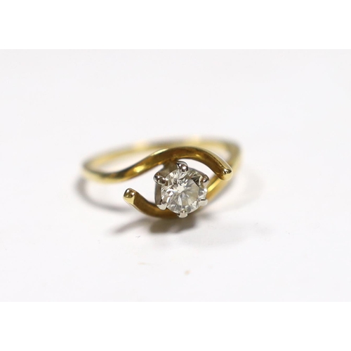 961 - A yellow metal and solitaire diamond set ring, with crossover shoulders, size M, gross weight 3.5 gr... 