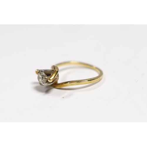 961 - A yellow metal and solitaire diamond set ring, with crossover shoulders, size M, gross weight 3.5 gr... 