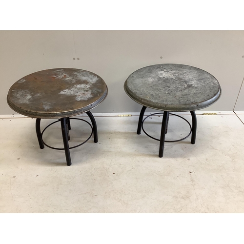 1004 - A pair of industrial style circular metal height adjustable occasional tables, diameter 54cm