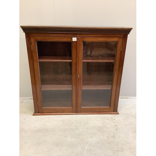 1017 - An early 20th century glazed mahogany bookcase, width 107cm, depth 28cm, height 102cm