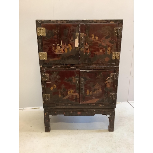 1020 - A Chinese lacquered two section cabinet on stand, width 84cm, depth 51cm, height 128cm