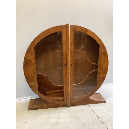 1021 - An Art Deco circular walnut veneered display cabinet, width 126cm, depth 30cm, height 125cm