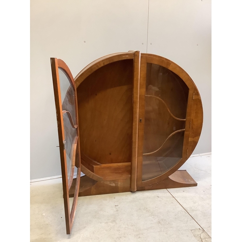 1021 - An Art Deco circular walnut veneered display cabinet, width 126cm, depth 30cm, height 125cm