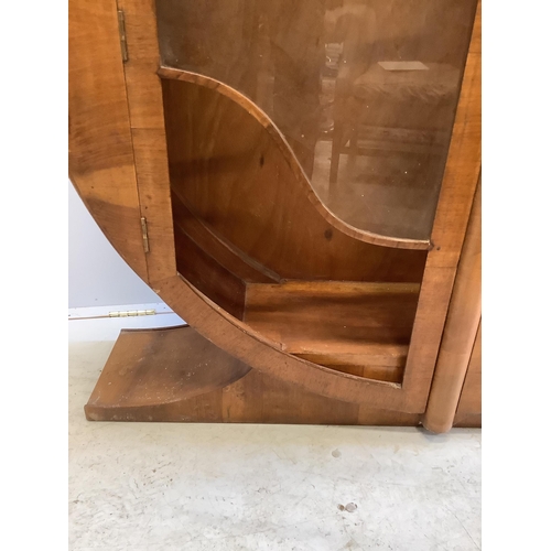 1021 - An Art Deco circular walnut veneered display cabinet, width 126cm, depth 30cm, height 125cm