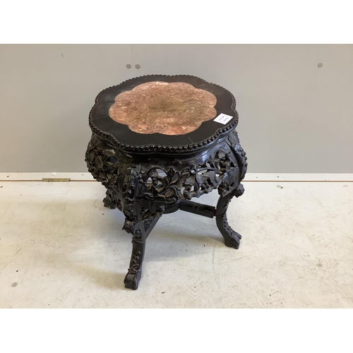 1036 - A Chinese circular hardwood rouge marble topped jardiniere stand, diameter 42cm, height 47cm