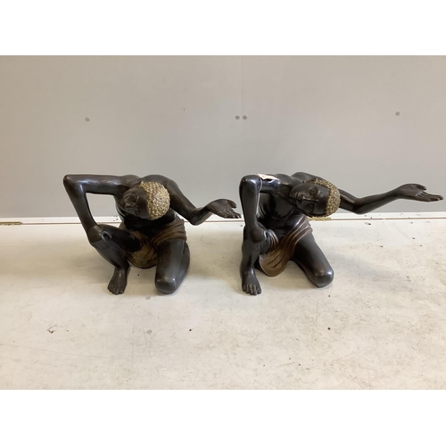 1042 - A pair of bronze Blackamoor table stands, width 57cm, height 43cm