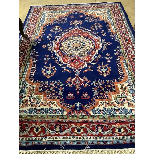 1050 - A North West Persian style blue ground carpet, 260 x 180cm