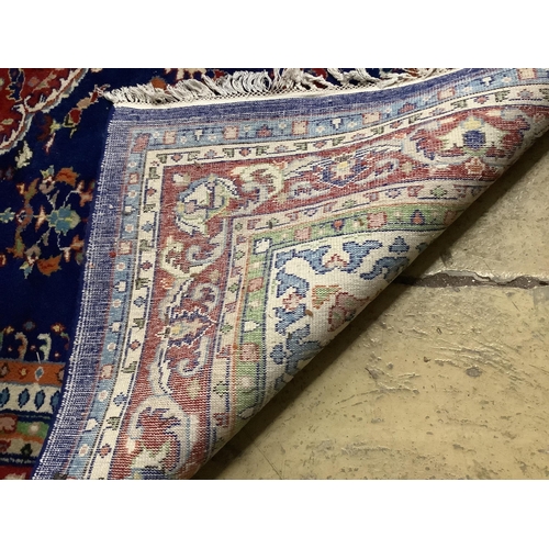 1050 - A North West Persian style blue ground carpet, 260 x 180cm