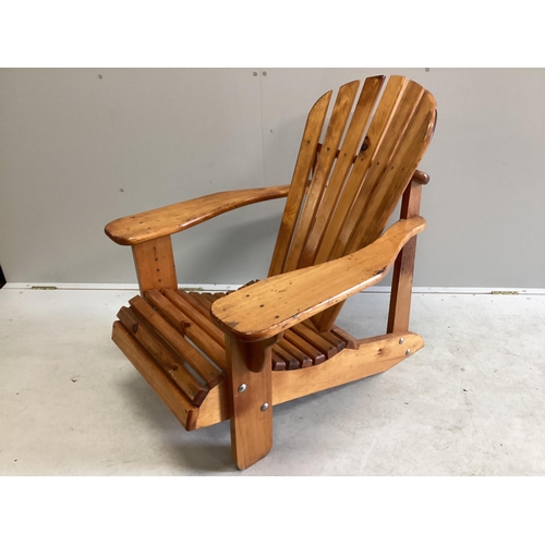 1083 - A stained pine Adirondack garden chair, width 78cm, depth 98cm, height 90cm