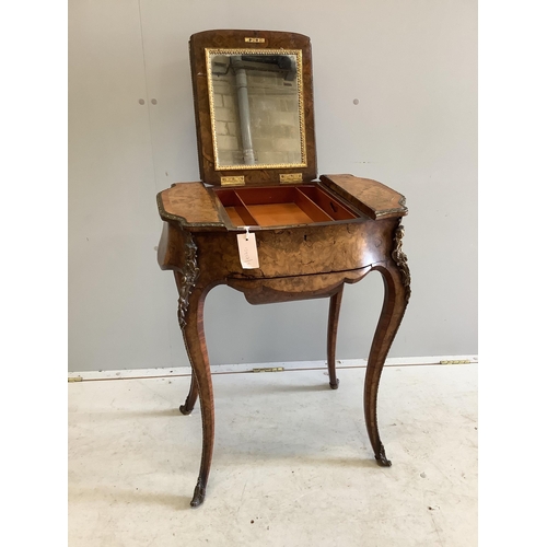 1089 - A Victorian gilt metal mounted tulip banded burr walnut enclosed dressing table/work box, width 56cm... 