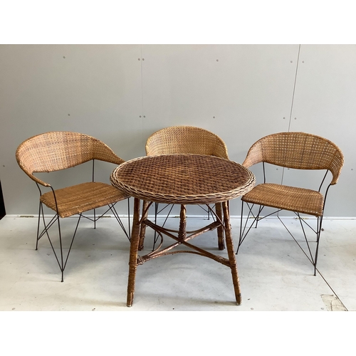 1092 - A circular wicker table, diameter 83cm, height 70cm together with three wicker tub framed chairs... 