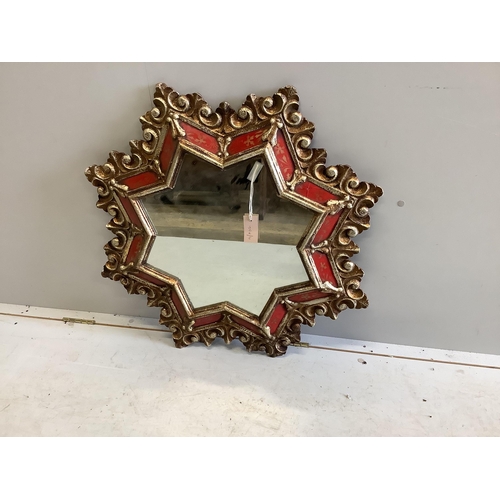 1120 - A giltwood and composition star shaped wall mirror, width 78cm