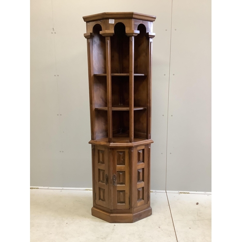 1121 - A Spanish walnut corner cupboard, width 59cm, depth 40cm, height 179cm