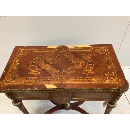 1143 - A Louis XVI style gilt metal mounted and marquetry inlaid folding card table, width 77cm, depth 40cm... 