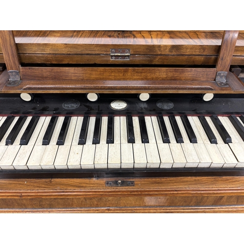 1145 - A Victorian walnut harmonium, width 106cm, depth 49cm, height 88cm