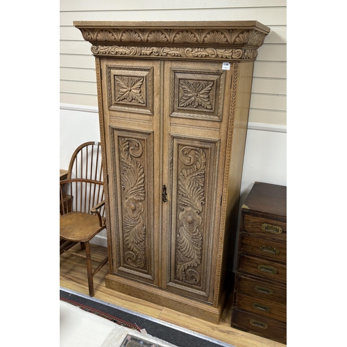 1149 - A late Victorian carved bleached oak wardrobe, width 103cm, depth 53cm, height 191cm