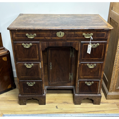 1154 - An 18th century banded walnut kneehole desk, width 80cm, depth 49cm, height 77cm